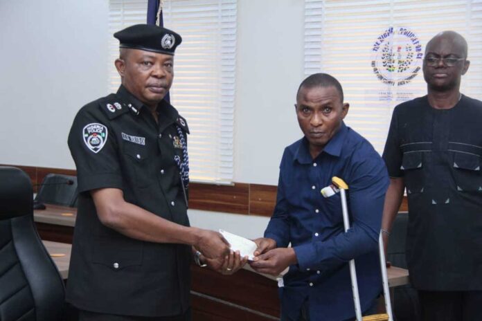 Akwa Ibom Cp Presenting Cheques To Families Of Fallen Officers