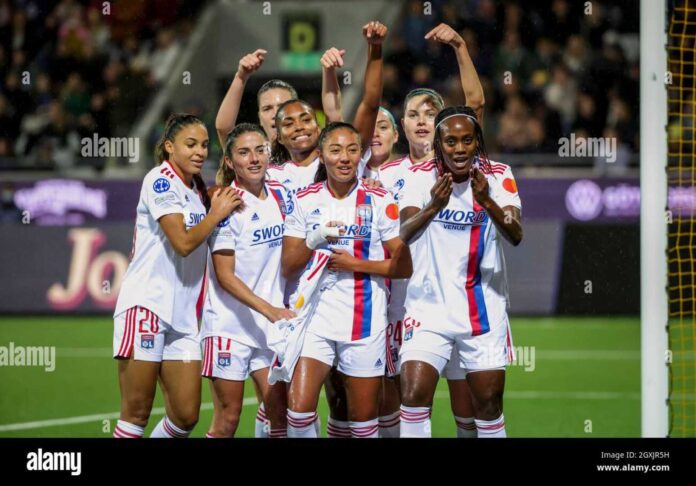 Lyon Women's Football Team Celebrating A Goal In The Women's Champions League