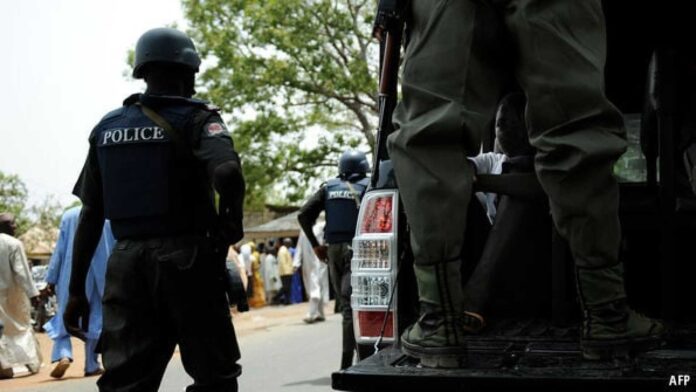 Nigeria Police Force Officers At A Scene Of Jungle Justice