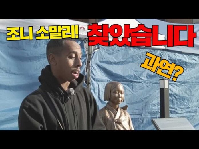 Johnny Somali Kissing Wartime Memorial Statue In Korea