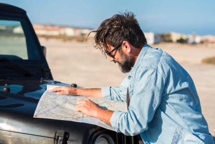 Man Showing Driver Destination On Paper