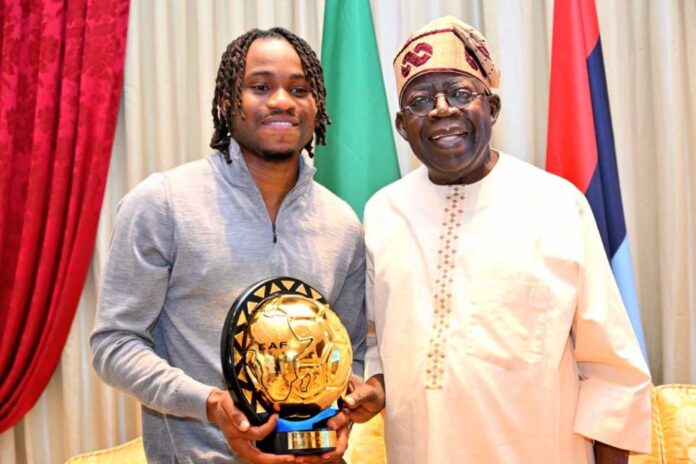 Ademola Lookman Presenting Award To Bola Tinubu