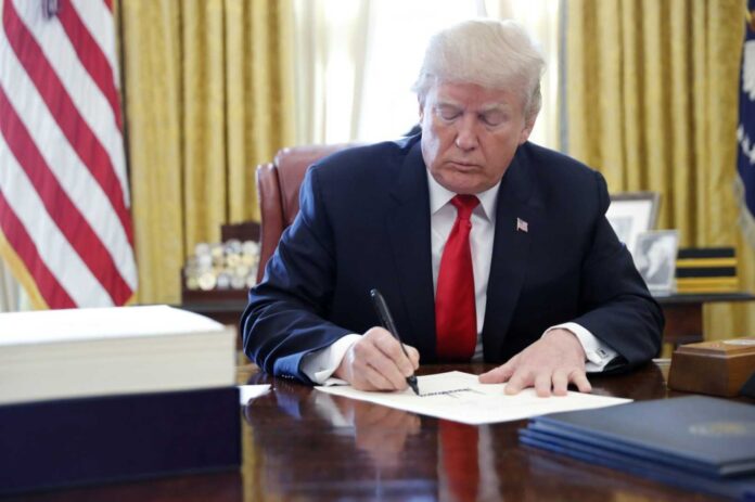 Donald Trump Signing Bill At The White House