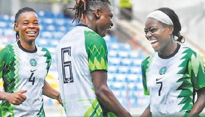 Toni Payne And Ashleigh Plumptre Playing Football