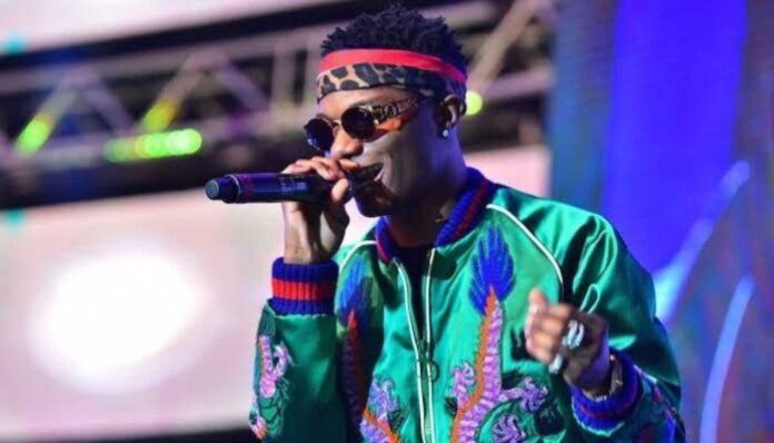 Wizkid Performing On Stage With Microphone