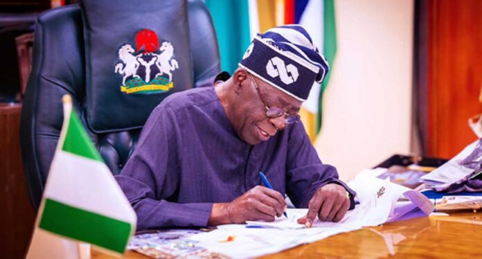 President Bola Tinubu Signing Clemency Document