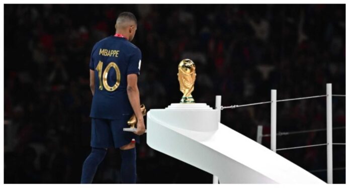 Kylian Mbappé Holding Golden Boot Trophy