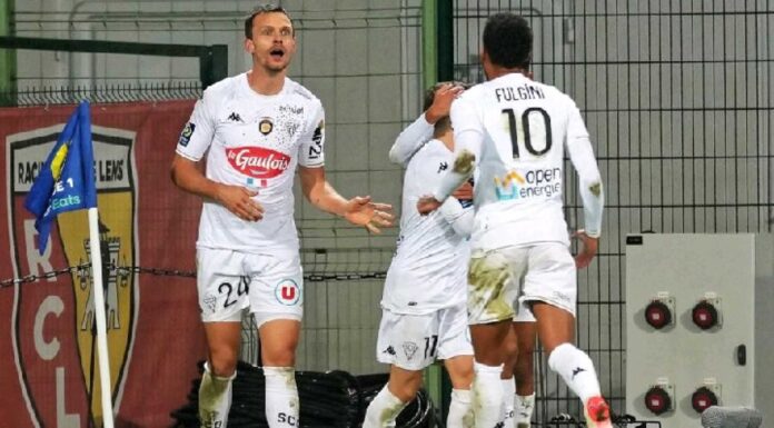 Lens And Lorient Players In Action