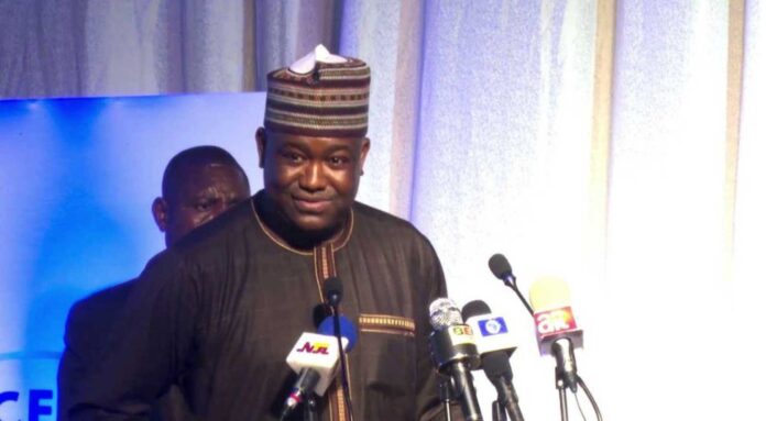 Gbenga Olawepo Hashim Speaking At A Meeting