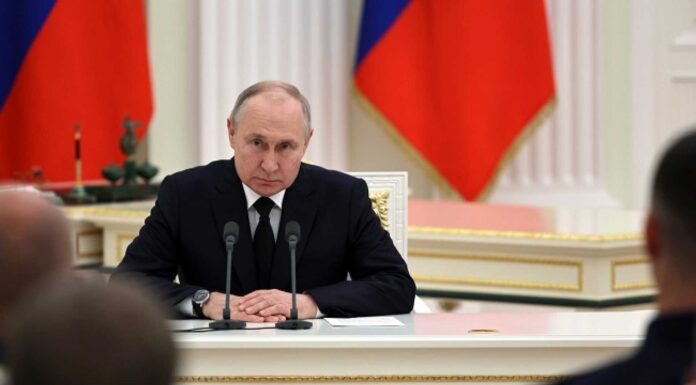 Vladimir Putin And Russian Paramilitary Fighters