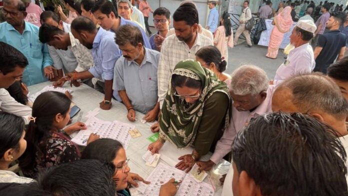 Voters Queue At Polling Station India 2026